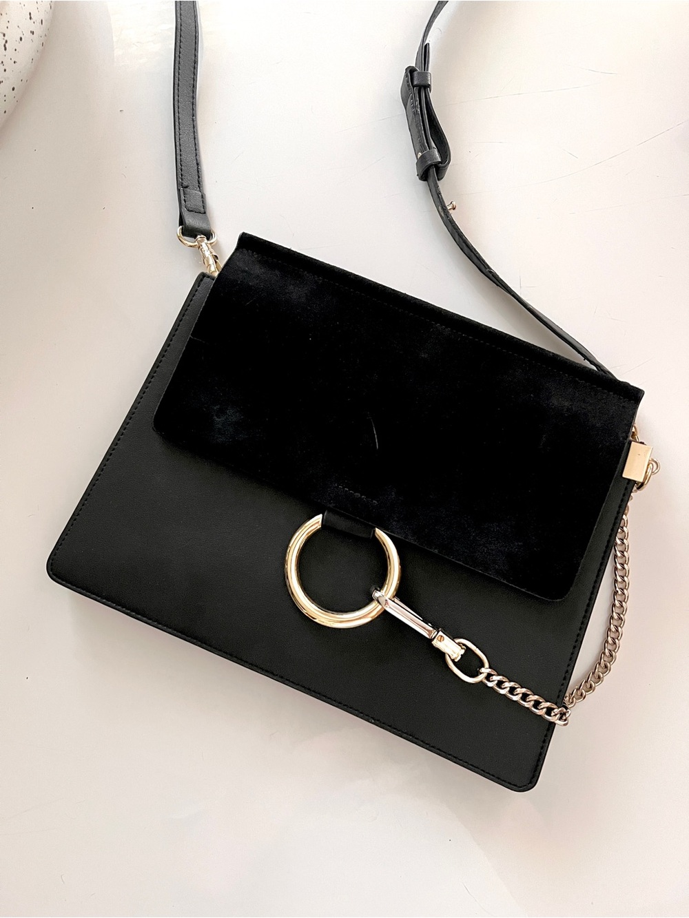 Black Leather and Suede Accordion Bag with Gold Ring Accent